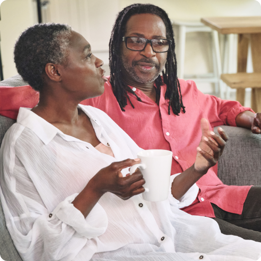 mature couple bonding on the couch together at home