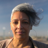 portrait of a happy black woman at the beach