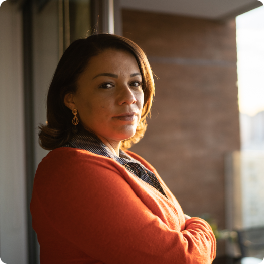 portrait of a mature woman by the window at home